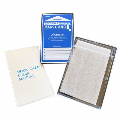 Alesis QuadraSynth RAM Card 1, a 256 KB SRAM memory card, shown with its clear storage case and its SRAM card users' manual. Product image showing the model, not a photograph of the unit for sale.