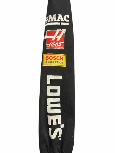 One sleeve of the jacket, showing GMAC, Haas CNC Machine Tools and Bosch Spark Plugs patches above Lowe's lettering.