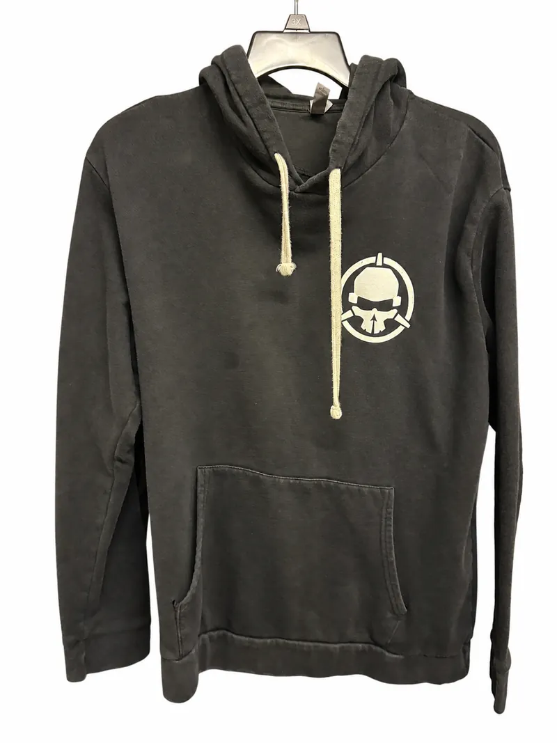 The front of the charcoal Rotor Riot hoodie on a hanger, with cream drawstrings and a small helmet-and-skull emblem on the chest.